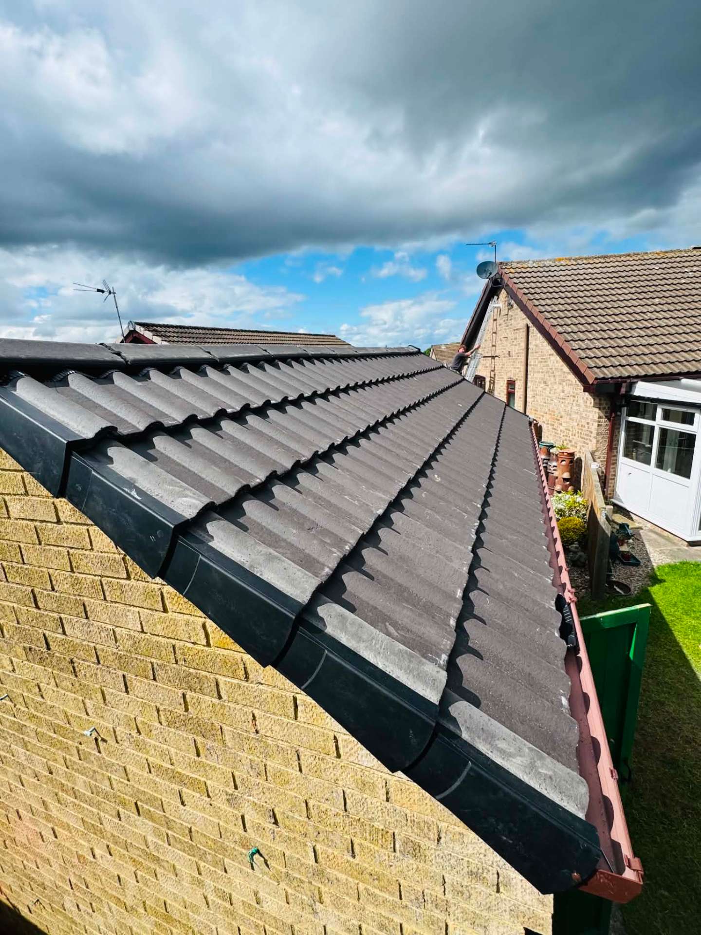 Completed pantile re-roof with new ridge, hip and dry verge on a bungalow